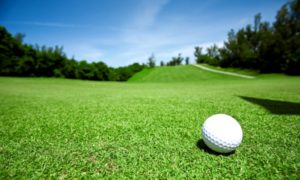 Closeup of golfball on green grass