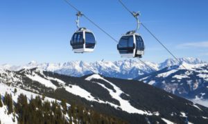 Two gondolas over mountain